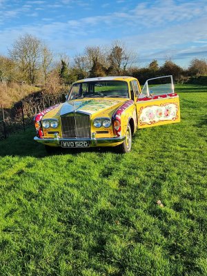 Yellow Rolls Royce.